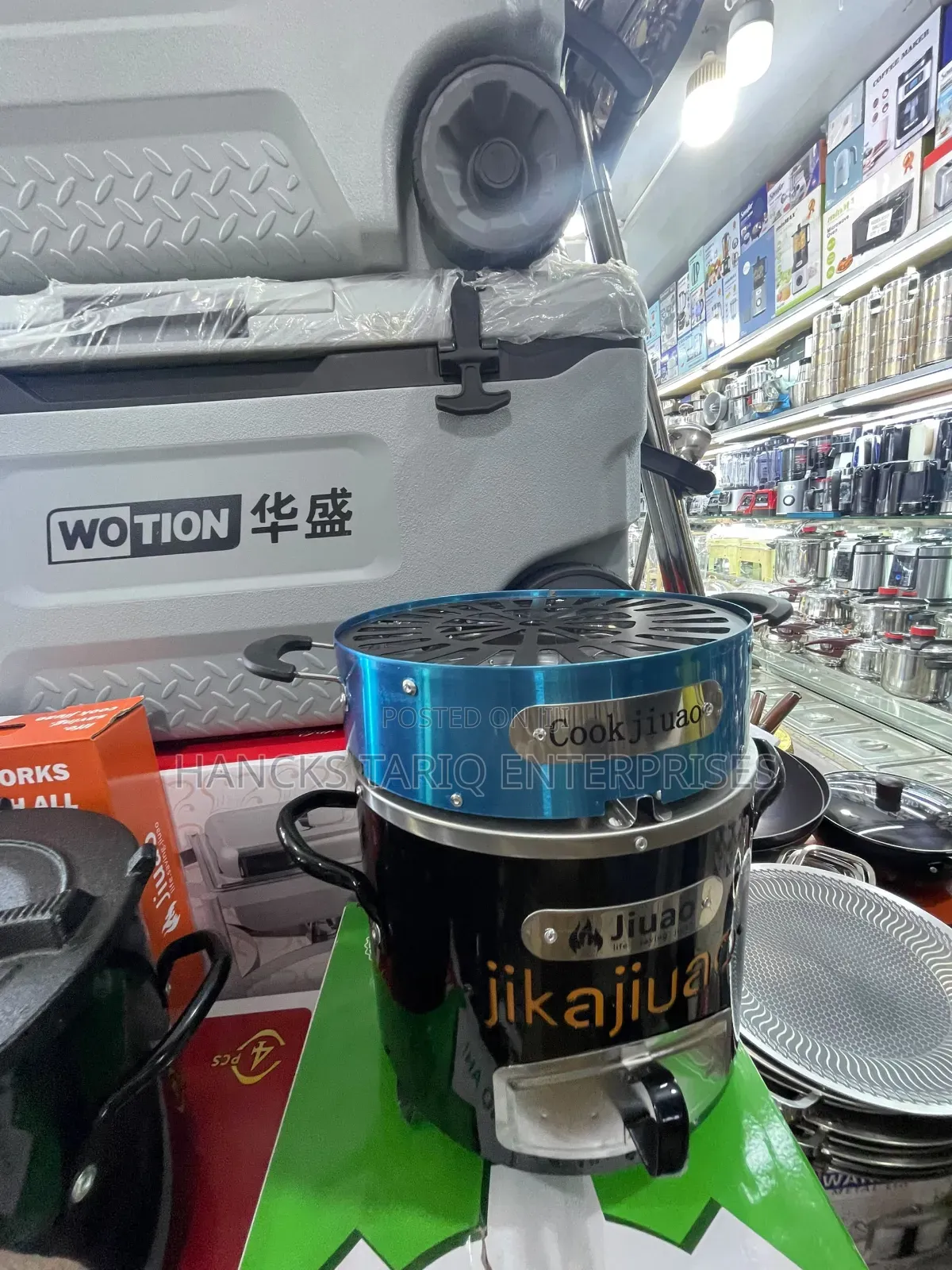 Portable "Jijuao" Brand Charcoal Stove With an Integrated Grill Top.