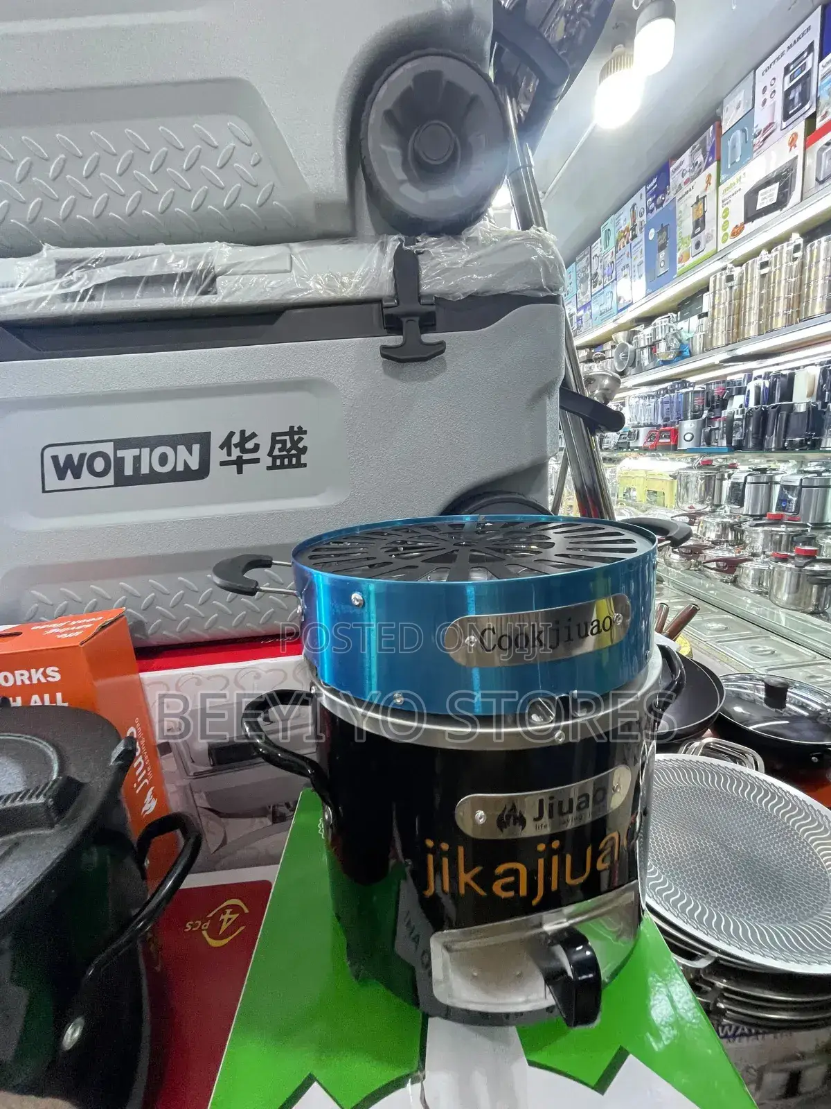 Portable "Jijuao" Brand Charcoal Stove With an Integrated Grill Top.