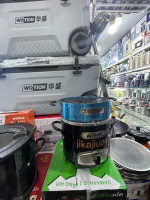 Portable "Jijuao" Brand Charcoal Stove With an Integrated Grill Top.