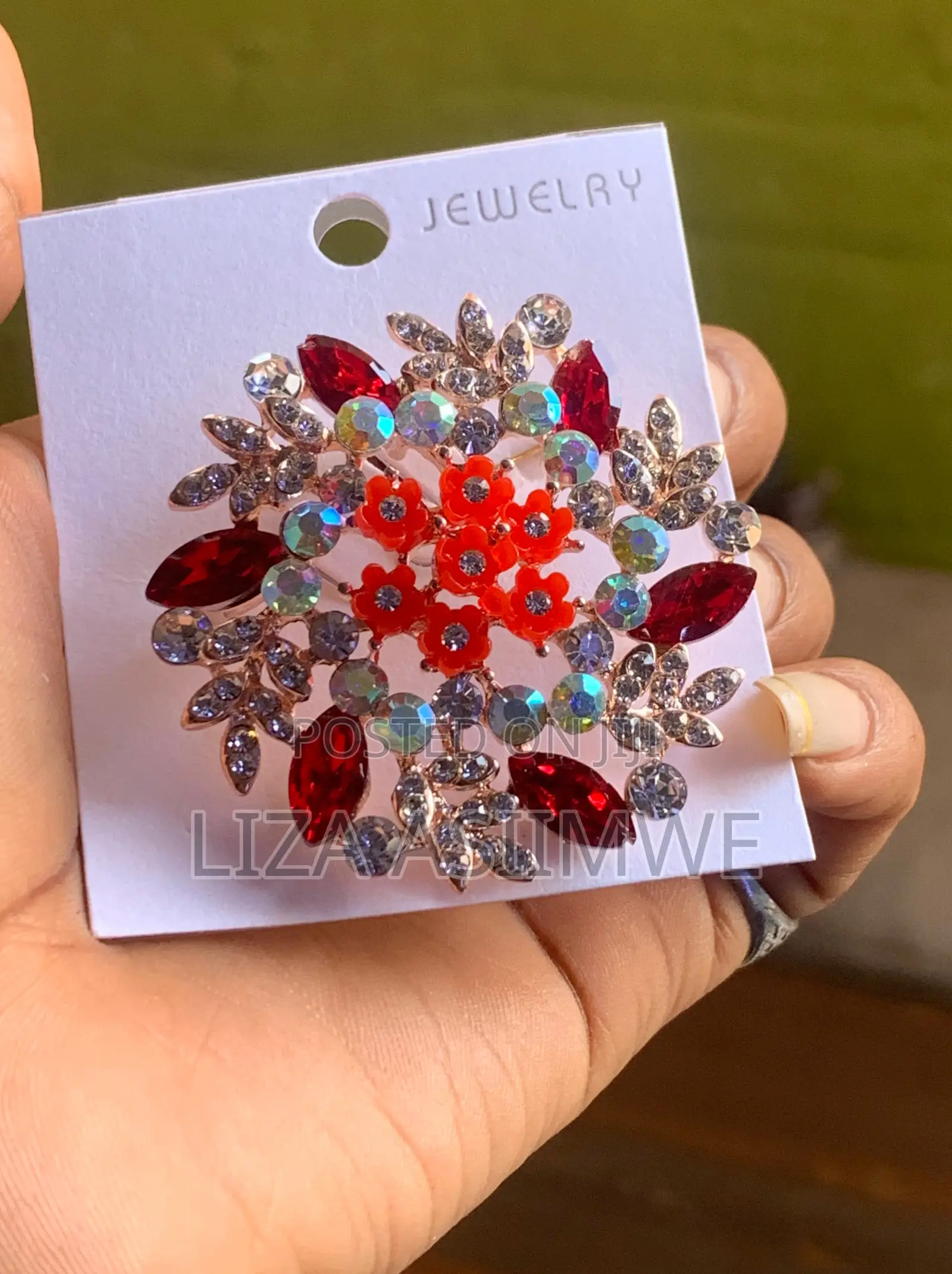 Floral Brooch Featuring a Prominent Center of Red Flowers
