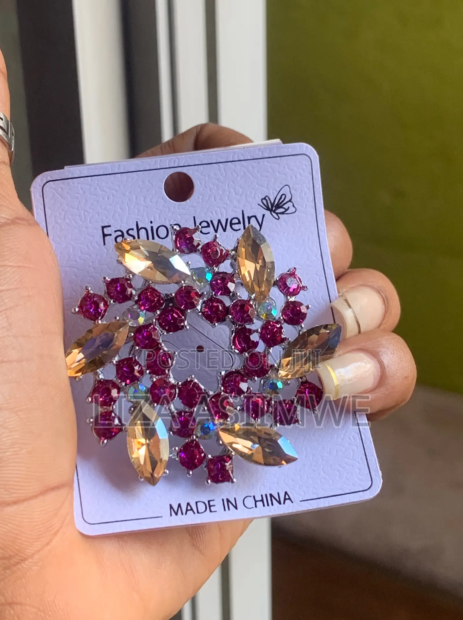 Brooch Features a Wreath Design Adorned With Bright Pink and Clear