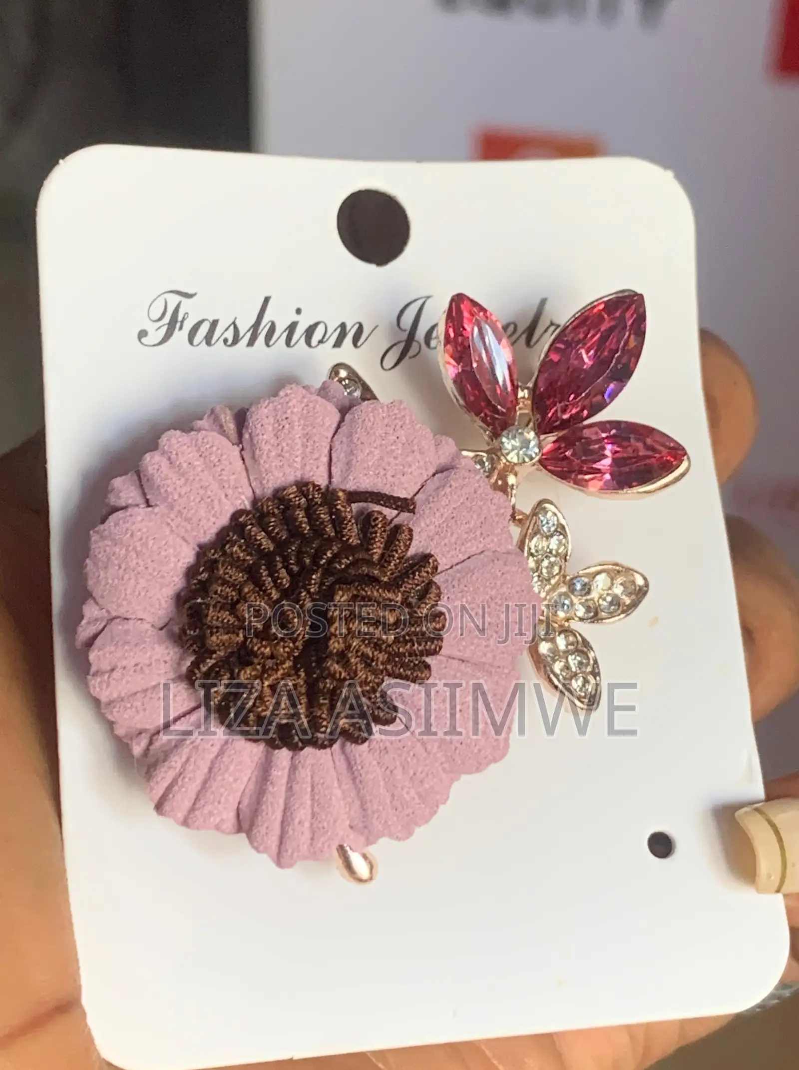 Pink Suede-Like Fabric Flower Brooch Features a Dark a Brown Center.
