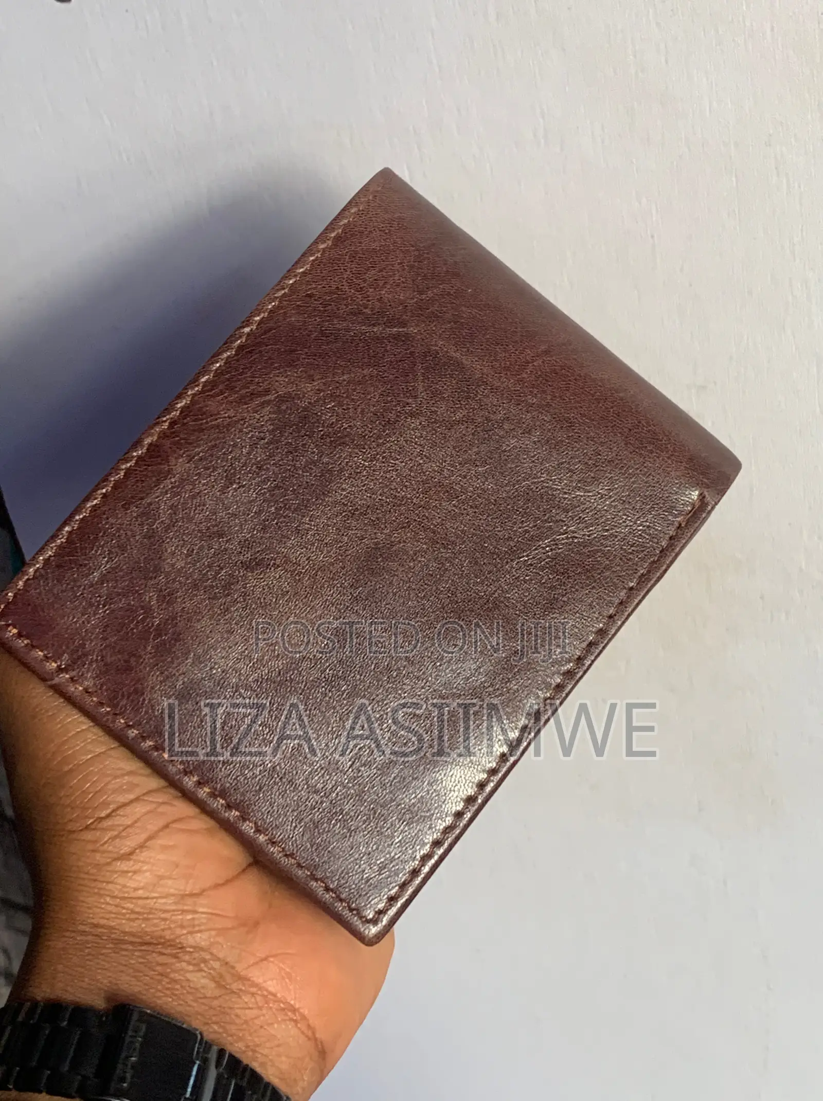Brown Leather Bifold Wallet Features an Embossed U.S. Polo. (Uspa)