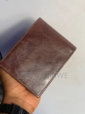 Brown Leather Bifold Wallet Features an Embossed U.S. Polo. (Uspa)
