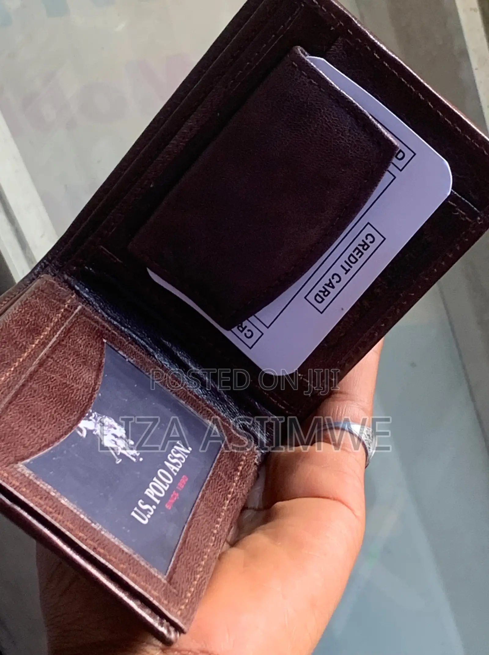 Brown Leather Bifold Wallet Features an Embossed U.S. Polo. (Uspa)