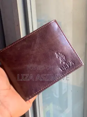 Brown Leather Bifold Wallet Features an Embossed U.S. Polo. (Uspa)
