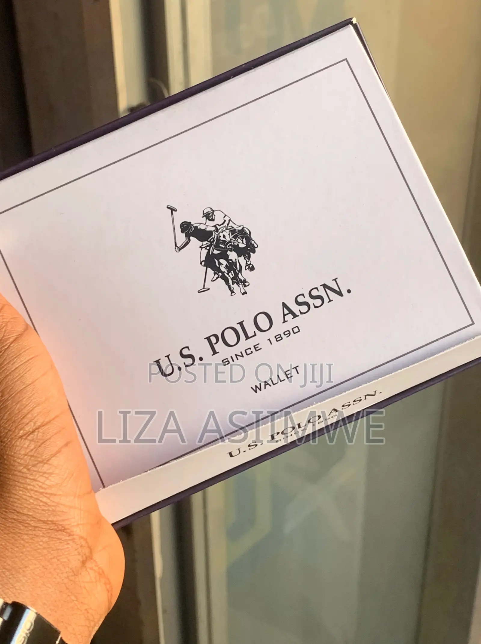 Brown Leather Bifold Wallet Features an Embossed U.S. Polo. (Uspa)