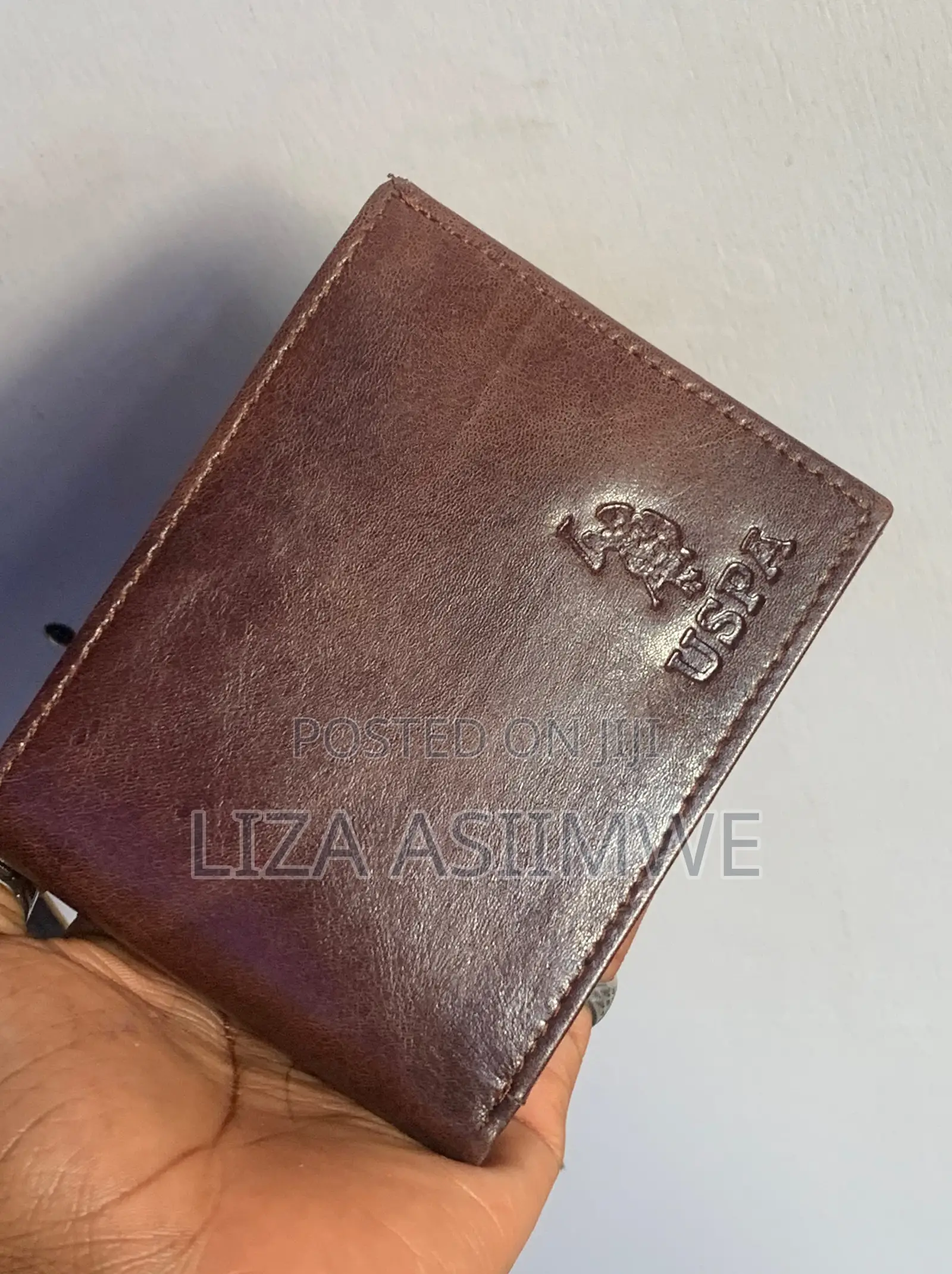 Brown Leather Bifold Wallet Features an Embossed U.S. Polo. (Uspa)