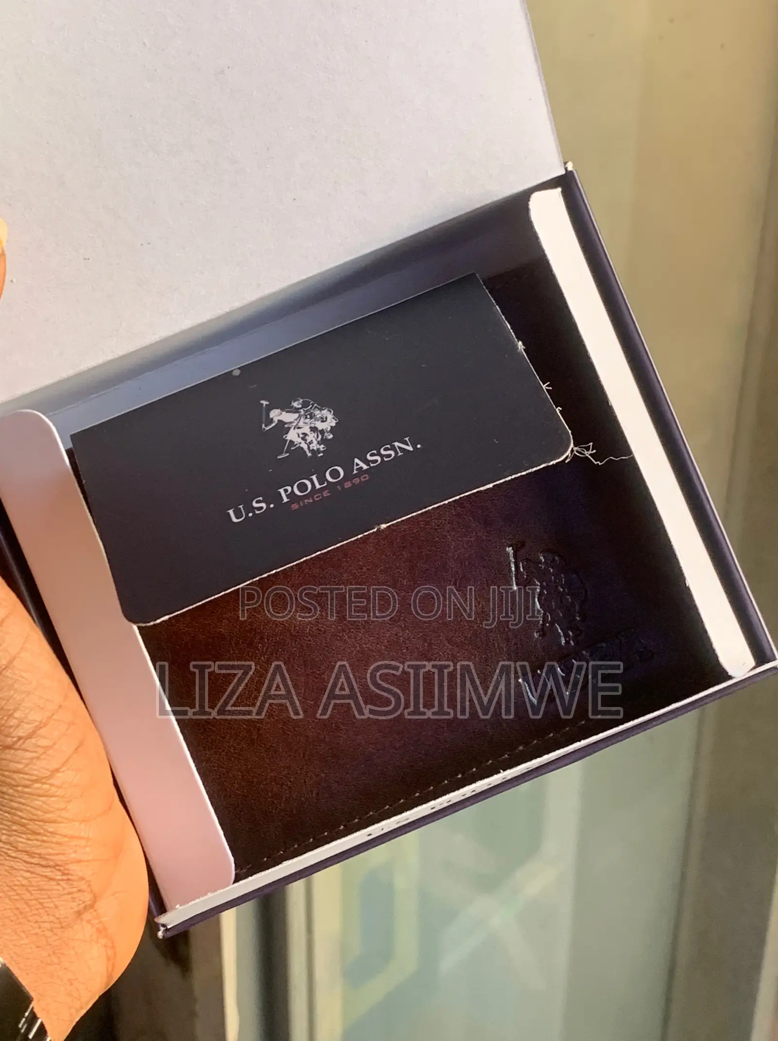 Brown Leather Bifold Wallet Features an Embossed U.S. Polo. (Uspa)