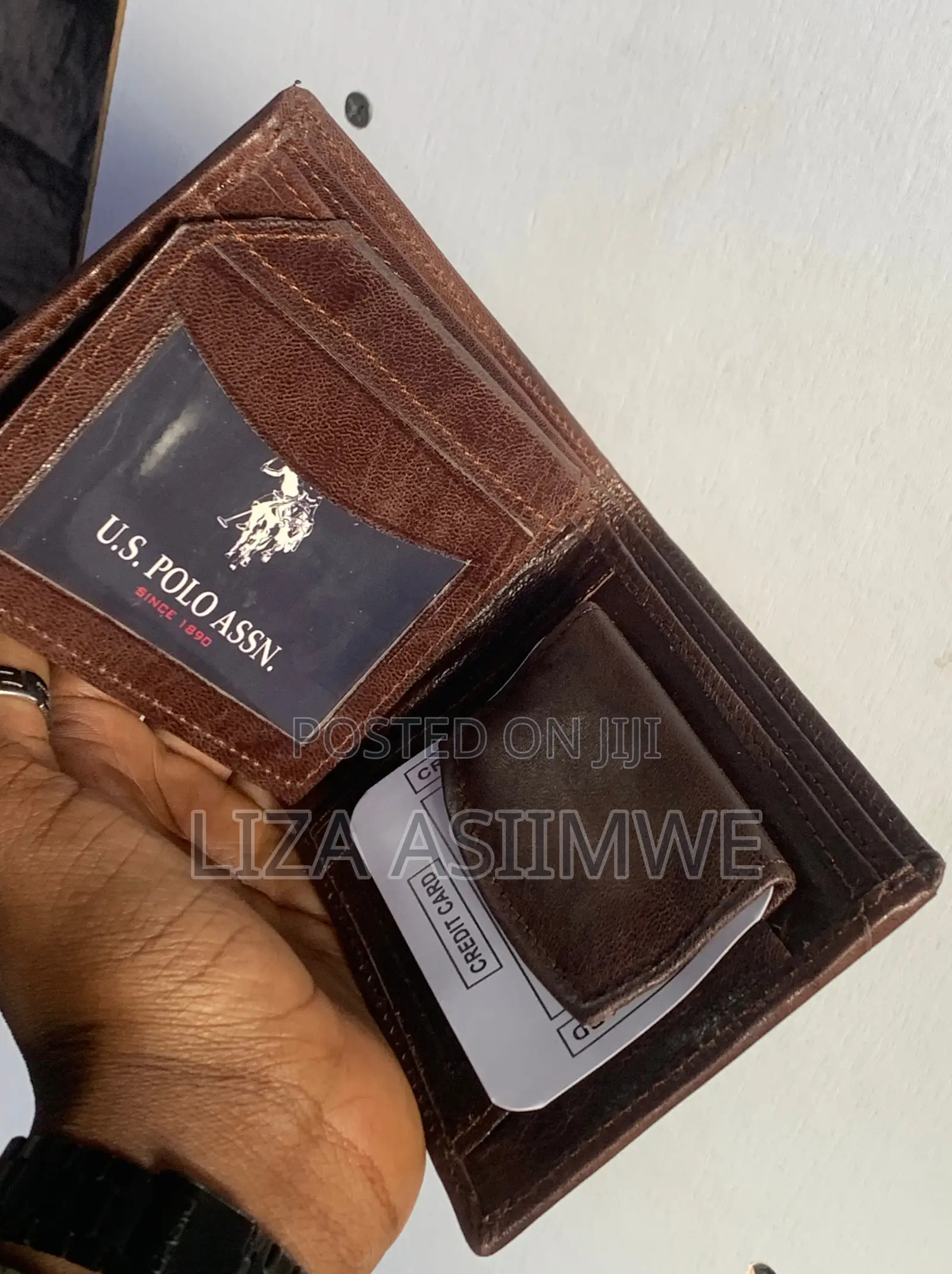 Brown Leather Bifold Wallet Features an Embossed U.S. Polo. (Uspa)