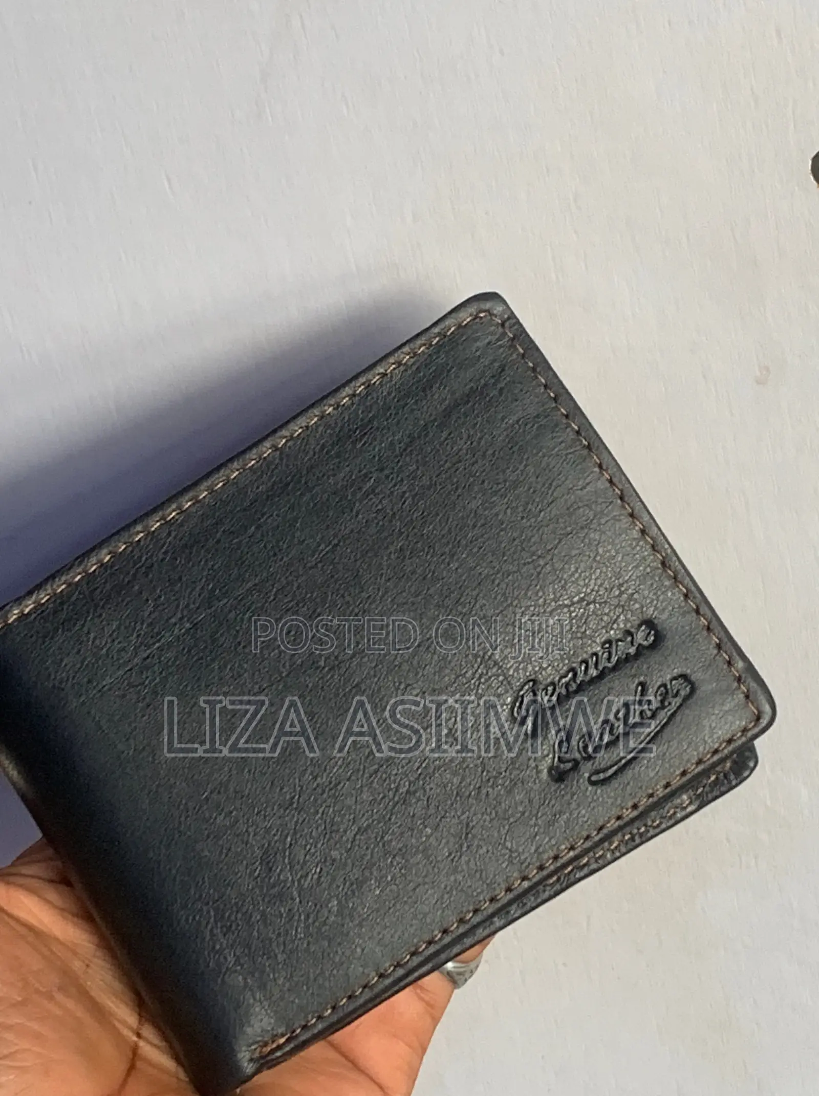 Bifold Wallet Is Crafted From Genuine Black Leather