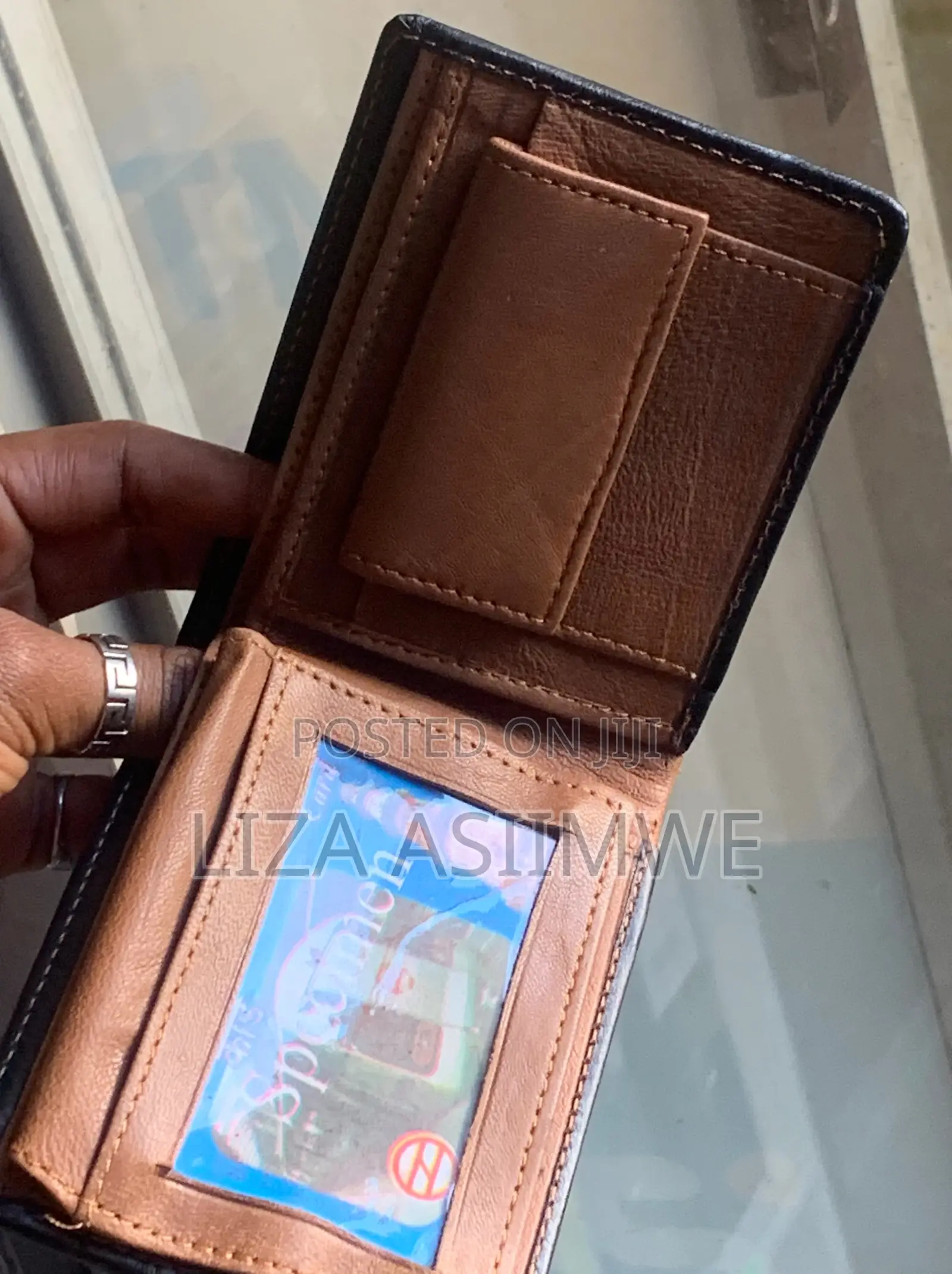 Bifold Wallet Is Crafted From Genuine Black Leather