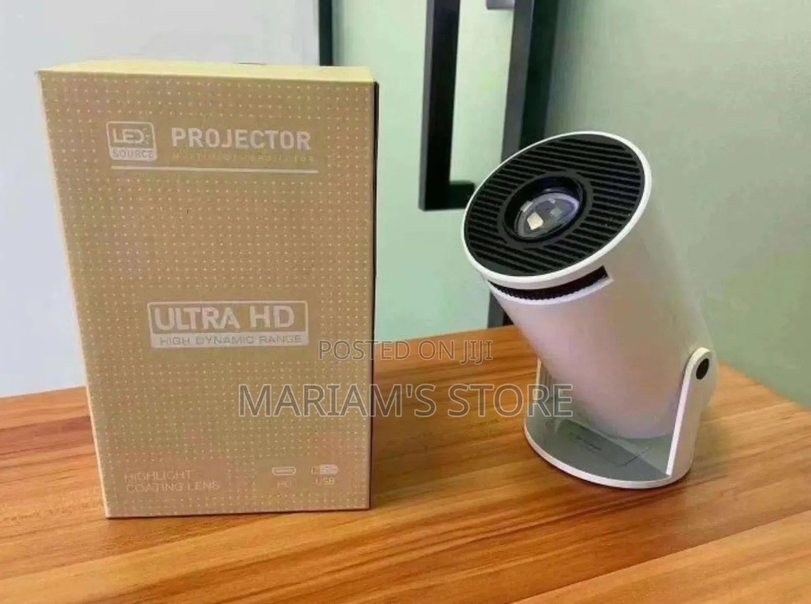 Portable Projector With a Cylindrical Design and 180° Rotatable Stand.