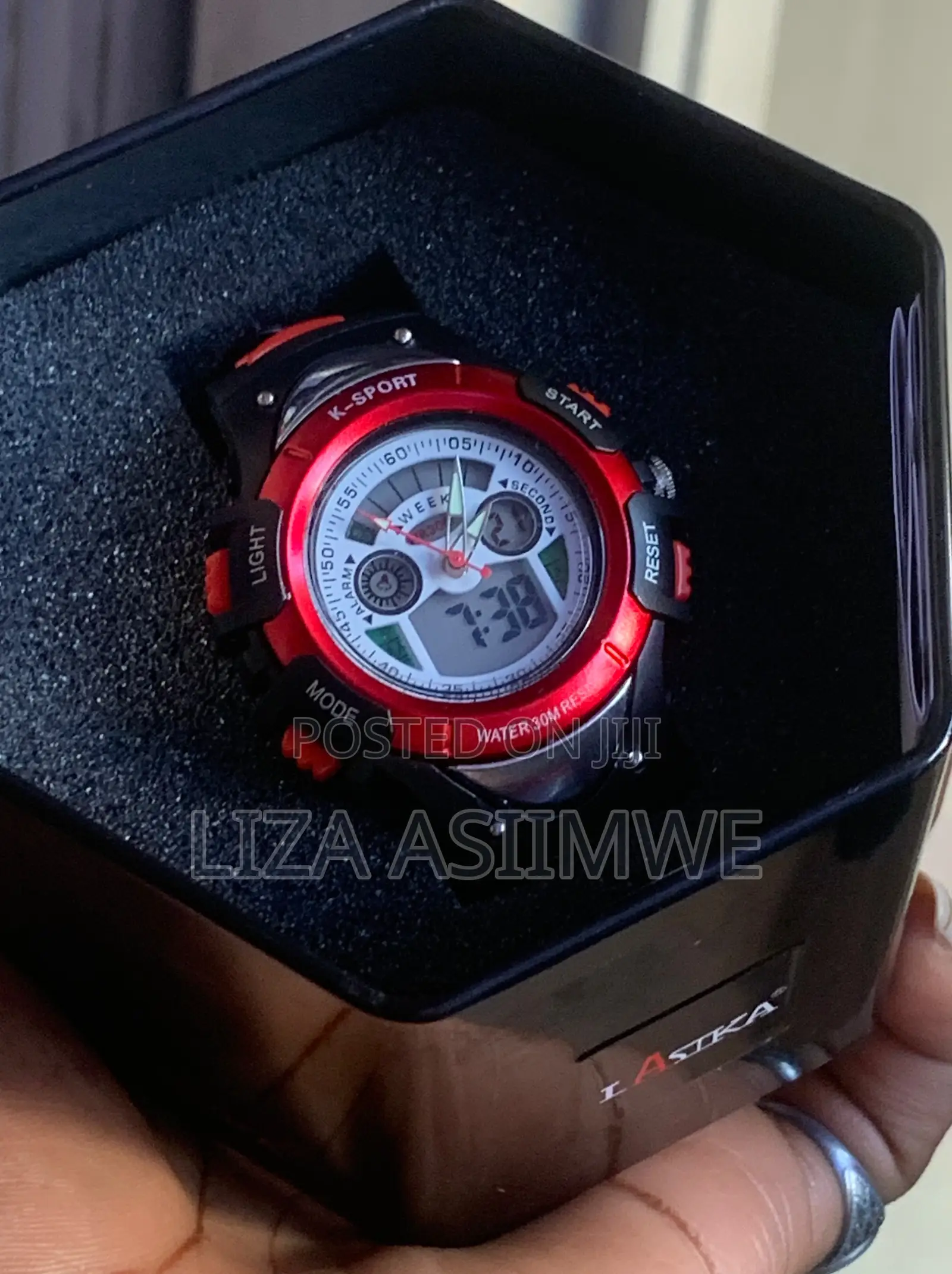 Kids Sports Watch With A Durable Black Strap And A Vibrant Red Bezel