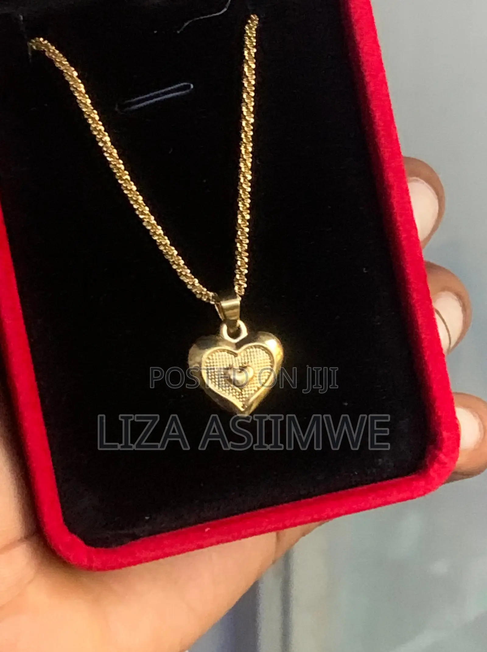 Lady’S Necklace With a Heart Shaped Pendant Inside a Larger Heart