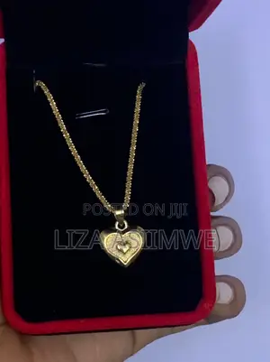 Lady’S Necklace With a Heart Shaped Pendant Inside a Larger Heart