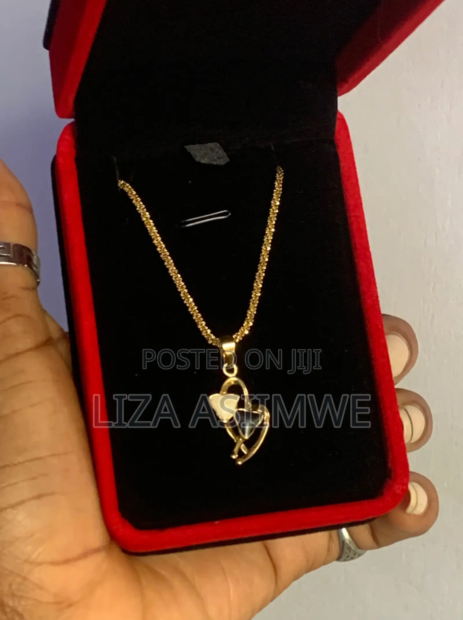 Lady’S Gold-Tone Heart Necklace Features a Distinctive Pendant