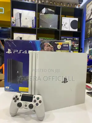 Buy This Ps4 Pro and Enjoy at Home. It Has 32 Games and 2 Controllers