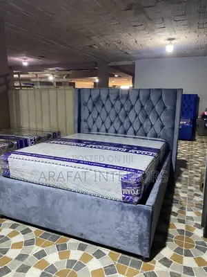 Elegant Wingback Tufted Bed