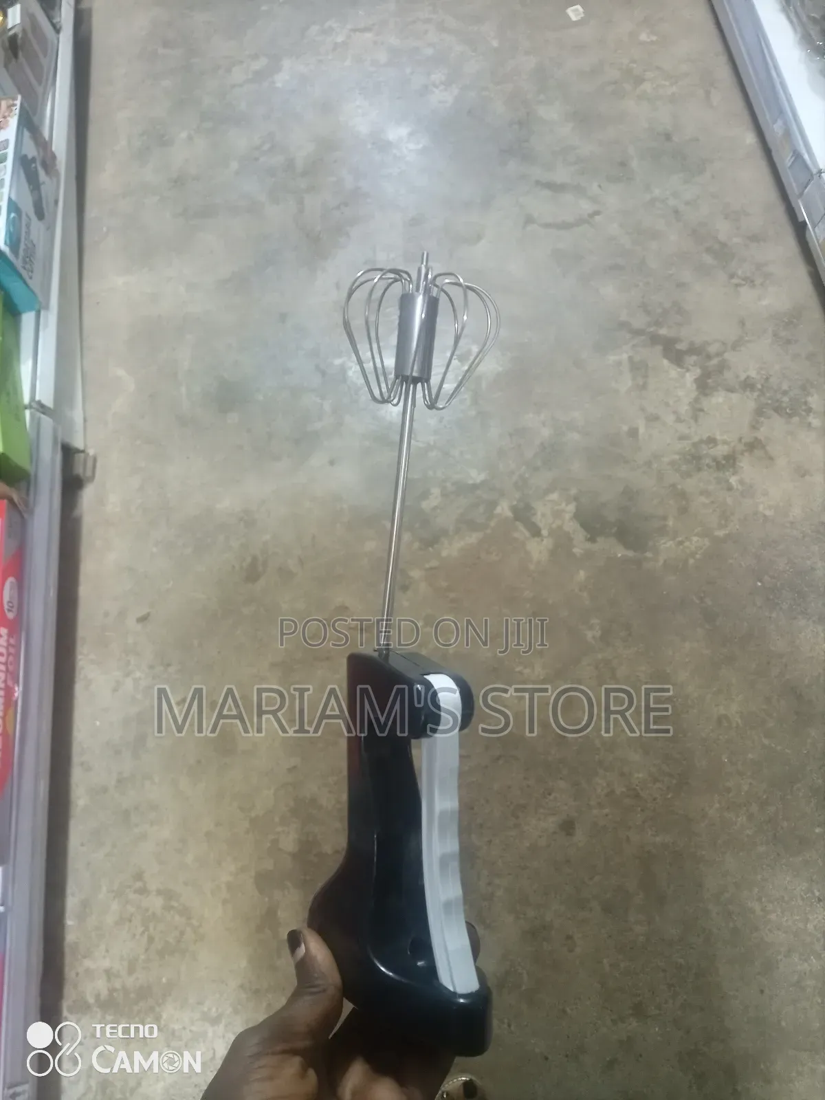 Semi-Automatic Kitchen Whisk With a Black Handle.
