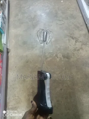 Semi-Automatic Kitchen Whisk With a Black Handle.