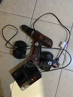 Rs Drill Machine With Two Batteries and a Charger