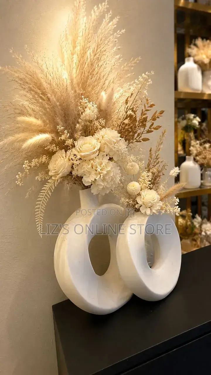 White Ceramic Vase Set Features a Modern, Donut-Shaped Hollow Design