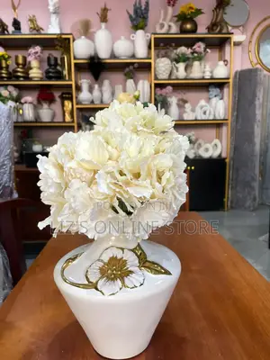 White Ceramic Vase Features Dimensional Gold Floral Details