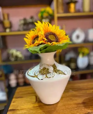 White Ceramic Vase Features Dimensional Gold Floral Details