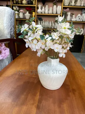 White Ceramic Vase Features a Vertical