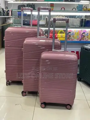 Pink Rubber Luggage Set Features a Distinctive Wavy Hard-Shell Texture