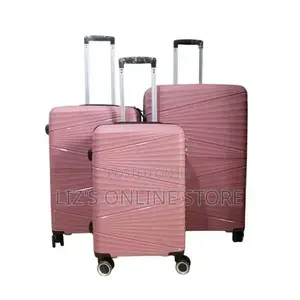 Pink Rubber Luggage Set Features a Distinctive Wavy Hard-Shell Texture