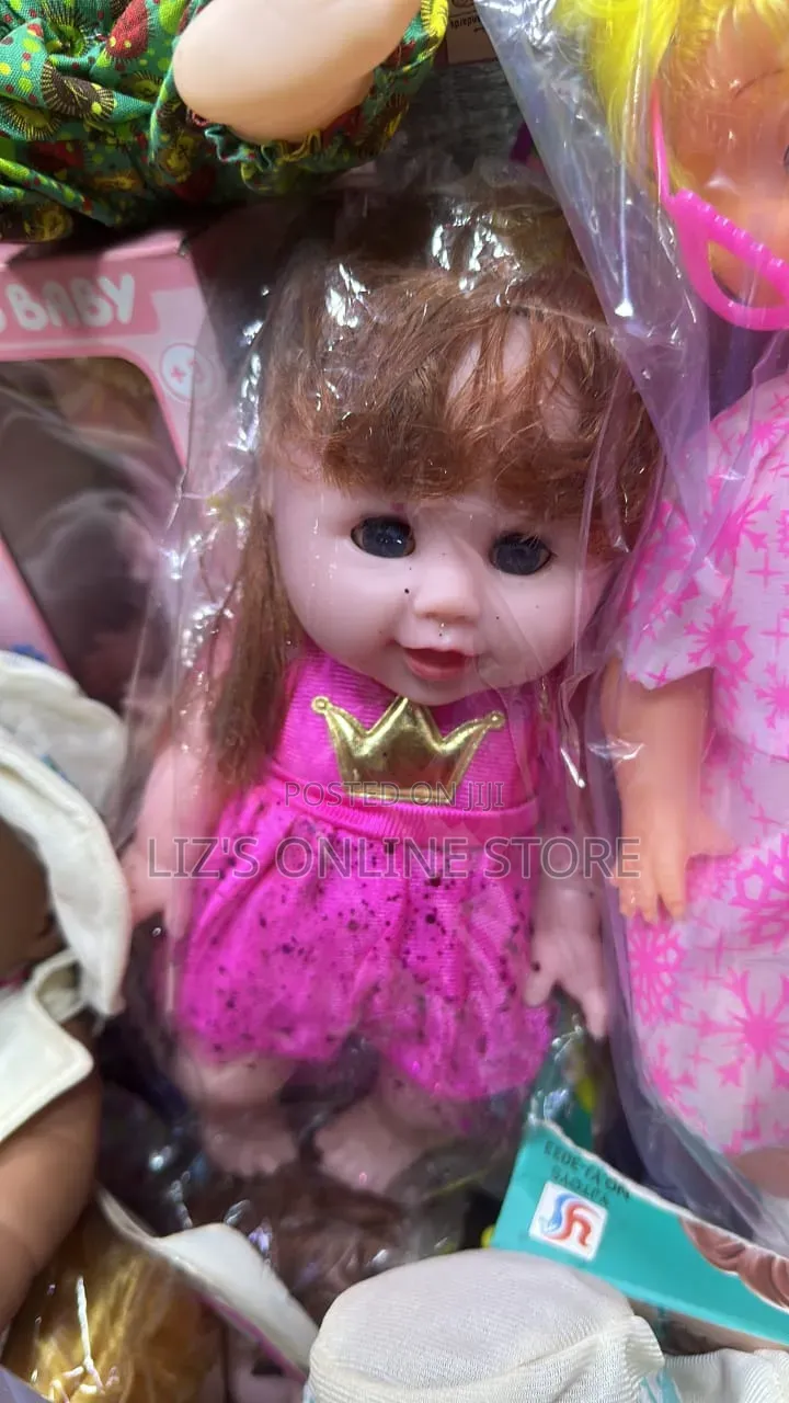 My Cute Baby" Doll Wearing a Bright Pink Dress Adorned