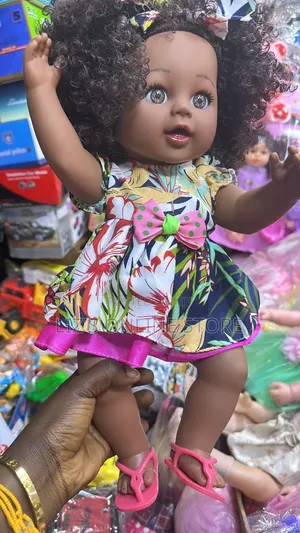 Doll Wearing a Colorful Tropical Print Dress