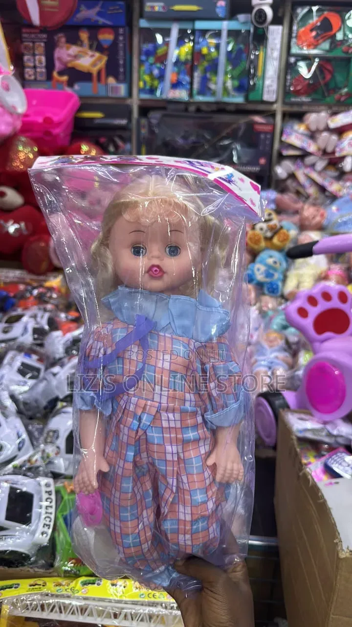 Generic Doll Featuring Blonde Hair and a Blue-Collared Checkered