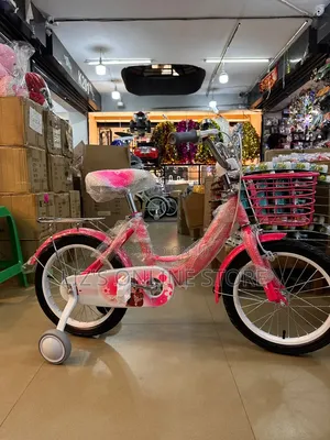 Bright Pink Child's Bicycle Features Removable Training Wheels