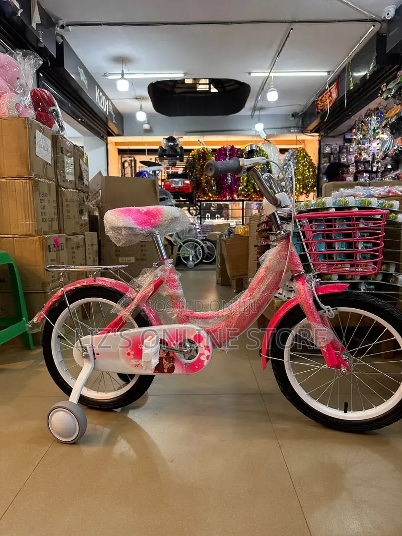 Bright Pink Child's Bicycle Features Removable Training Wheels