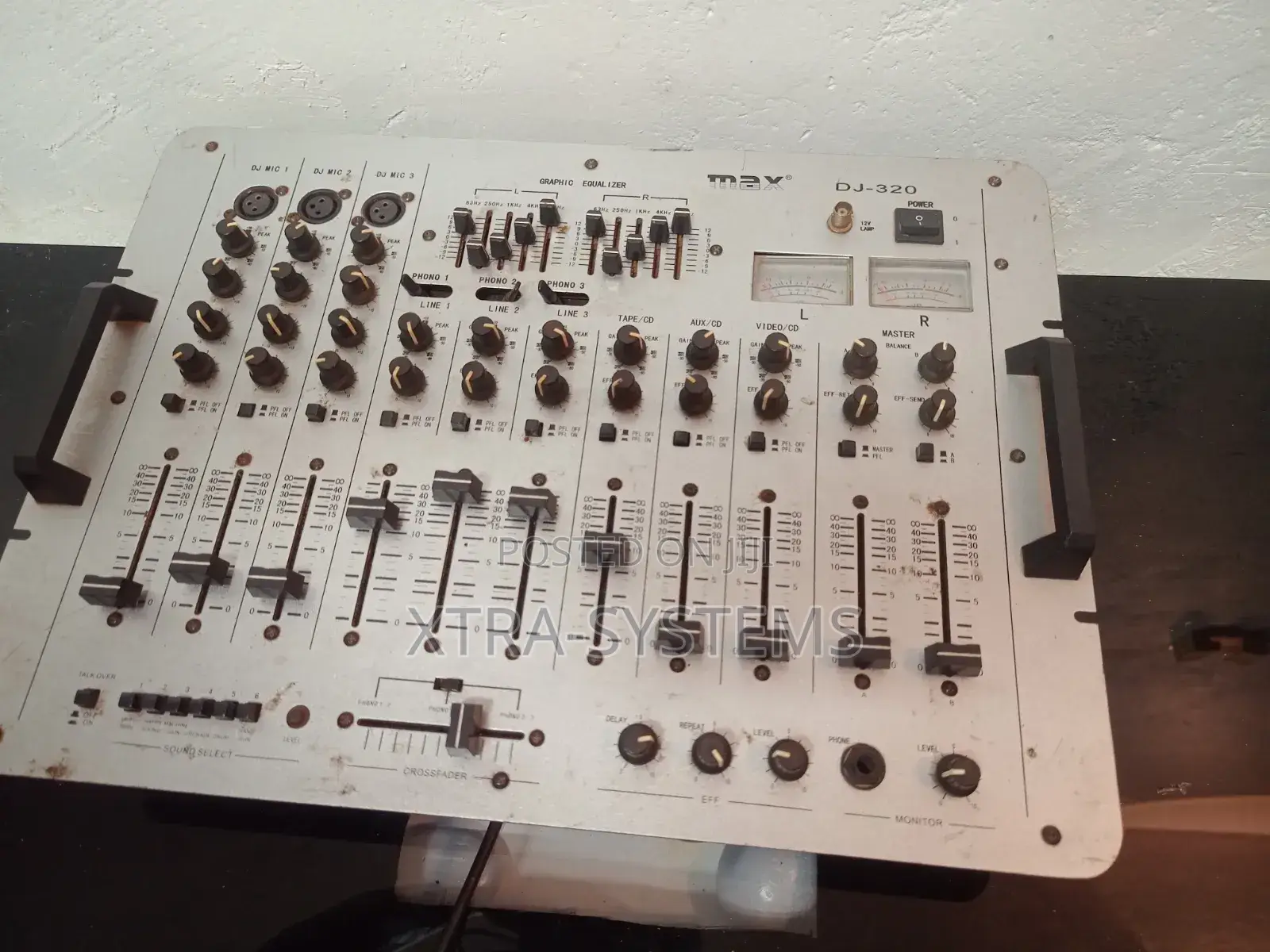 Dj Mixer With Multiple Channels and Controls.