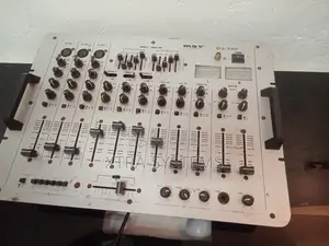 Dj Mixer With Multiple Channels and Controls.