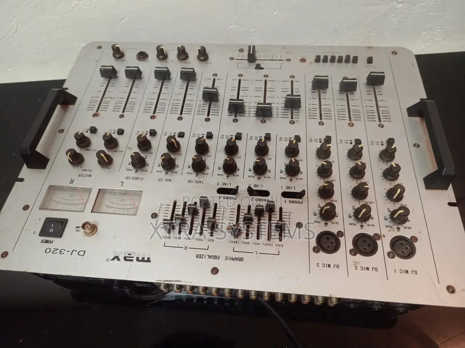 Dj Mixer With Multiple Channels and Controls.