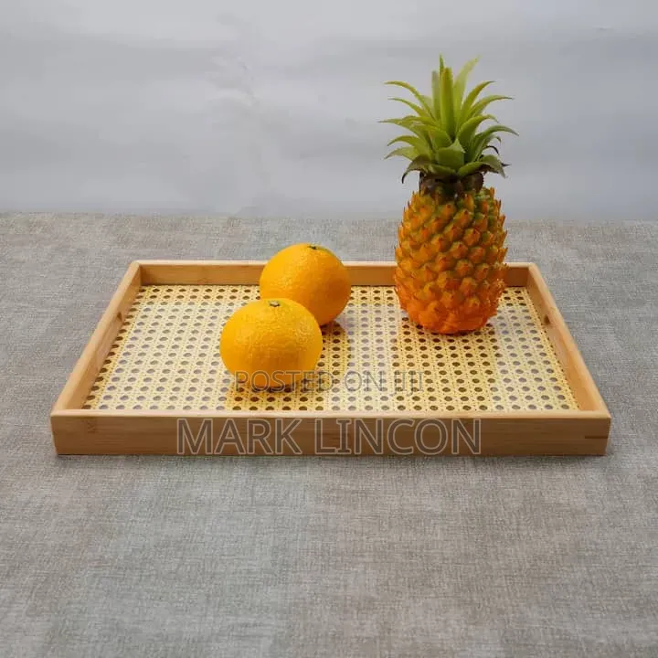 Rustic Wooden Tray Features a Distinctive Woven Rattan Base .
