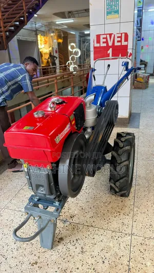 Walking Farm Tractor With Water Cooled Engine and Ox Plough