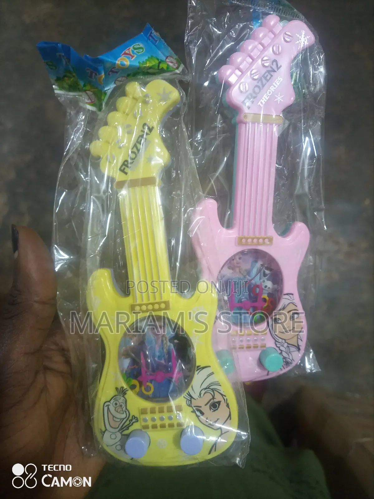 Plastic Musical Toy Guitars Featuring Characters From Frozen 2.