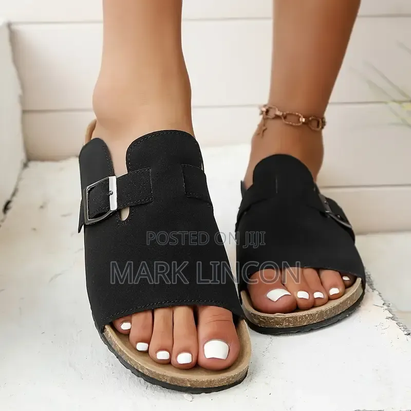 Unisex Slide Sandals Featuring a Black Upper Strap With a Metal Buckle