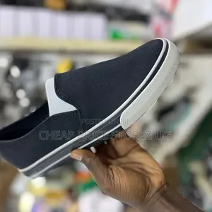 These Men's Slip-on Shoes Feature a Black Canvas Upper With White