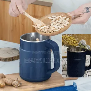 Portable, Mug-Shaped Electric Coffee Grinder.