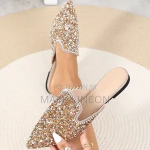 Ladies' Pointed-Toe Mule Flats Feature Intricate Pearl.