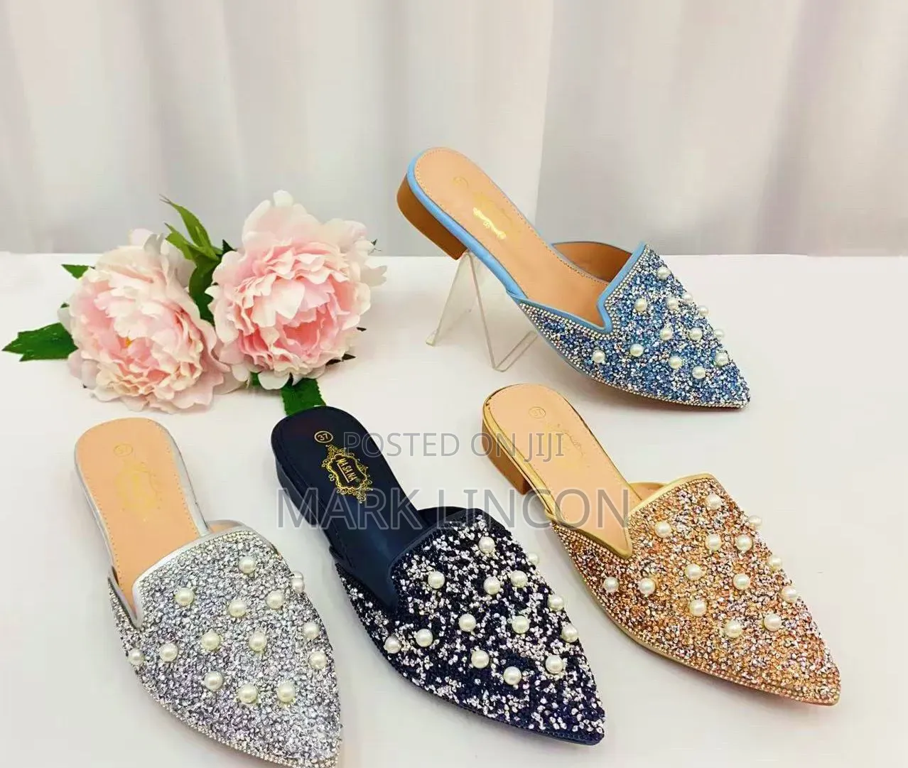 Ladies' Pointed-Toe Mule Flats Feature Intricate Pearl.