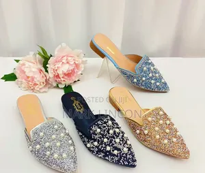 Ladies' Pointed-Toe Mule Flats Feature Intricate Pearl.