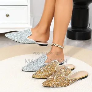 Ladies' Pointed-Toe Mule Flats Feature Intricate Pearl.